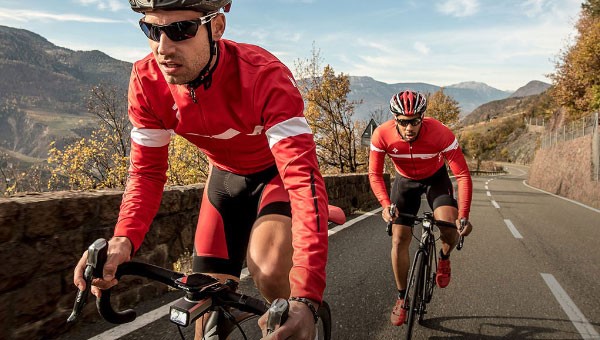 Front view of two road cyclists, one of which is using Garmin Technology 